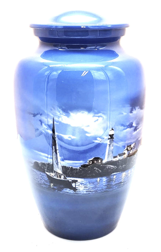 Lighthouse Adult Cremation Urn "Safe Passage" | Sailboat being guided  by the Lighthouse